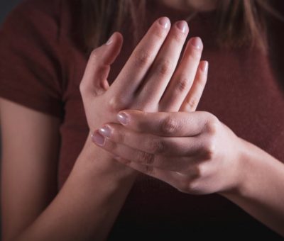 woman holding her hands, closeup